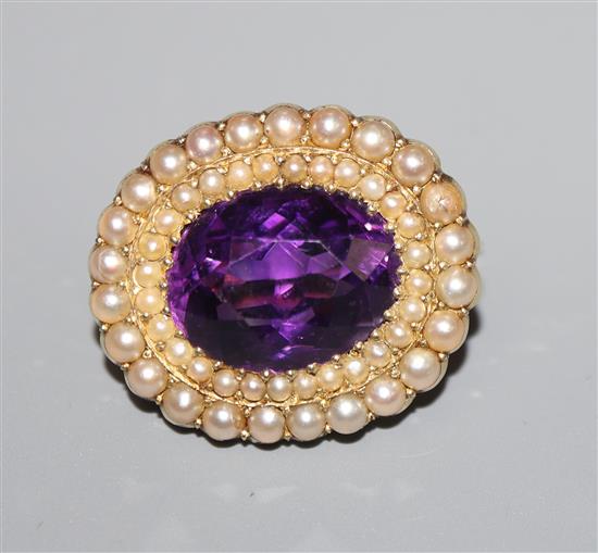 A late Victorian 15ct gold, amethyst and seed pearl set oval brooch, 22mm.